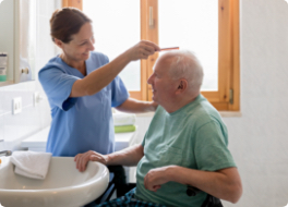 carer combing mans hair