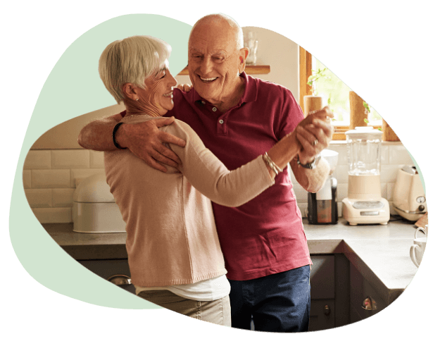 elderly couple dancing together