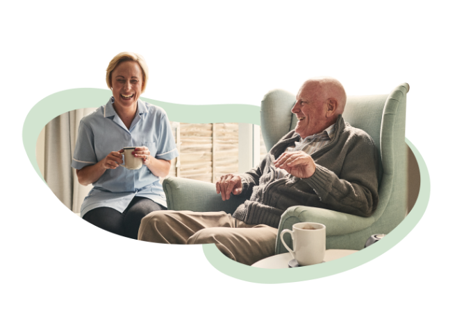 carer laughing with resident