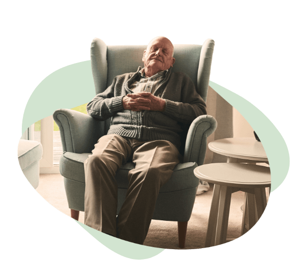 elderly man asleep in his chair